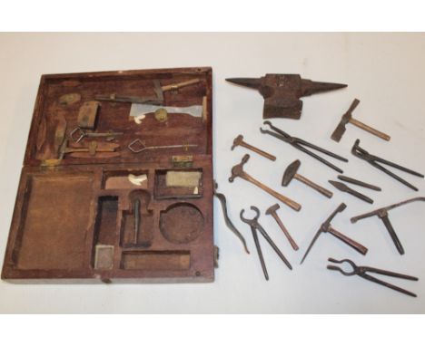 An unusual old miniature apprentice-style tool set, possibly of Cornish mining origin, comprising numerous hammers, iron tong