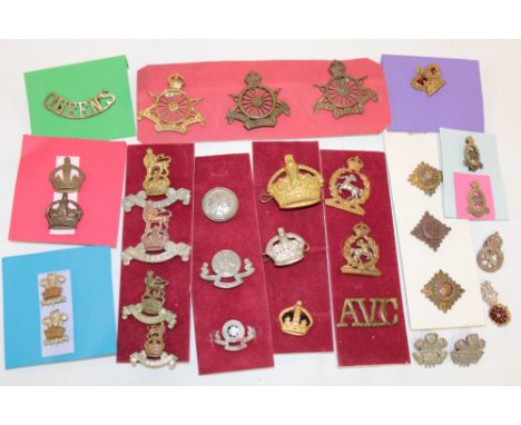 A selection of various Military cap badges and insignia including Army Cyclists Corps., Royal Army Pay Corps., Army Veterinar