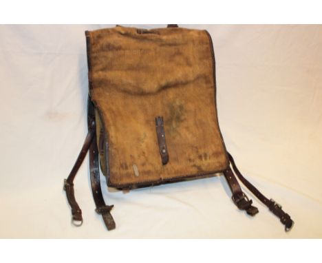 A Second War German Army leather and canvas rucksack dated 1940, the straps marked "7/J.R.21 1" together with a Second War Ge