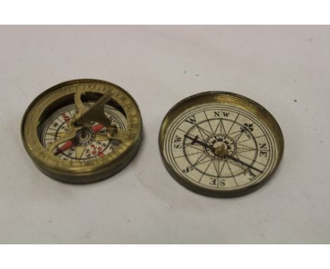 An old brass miniature pocket compass/sundial