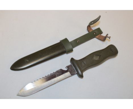 A post-War German combat knife in composition scabbard