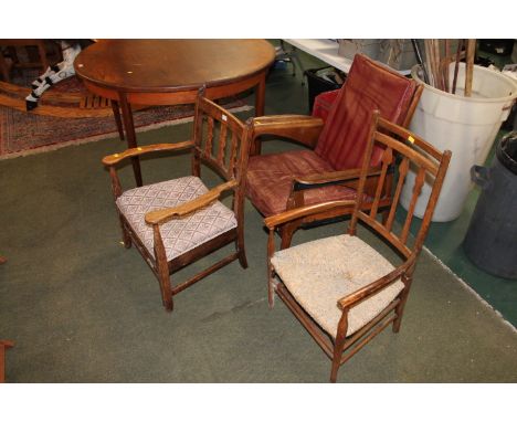 Three armchairs, one in the manner of Green Man/Spirit chair, a Mid Century Dunlop leather cushioned armchair and a single ru