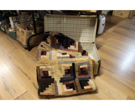 Vintage suitcase containing velvet quilt . 