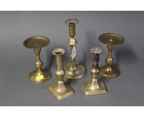 Five brass candlestick holders, tallest 21 cm  