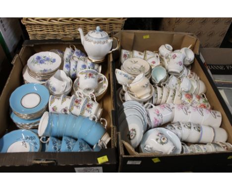 Two boxes of mixed patterned teacups and saucers, teapots, milk jug, sugar bowls