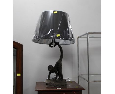 Monkey form table lamp with black shade