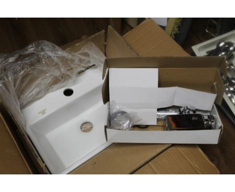 White ceramic cloakroom sink with tap
