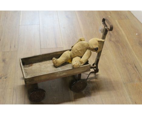 Vintage wooden child's cart and well loved Teddy bear 