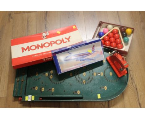 Green bagatelle board, monopoly game, Vickers Viscount aeroplane model, boxed set of snooker balls and child's Vulcan sewing 