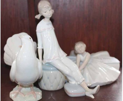 NAO FIGURE OF A BALLERINA
together with a Lladro figure of a girl and a Lladro dove (3)