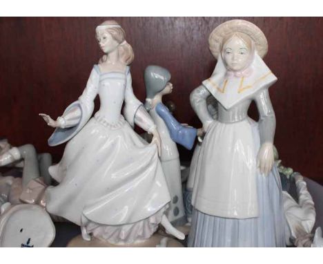 COLLECTION OF ELEVEN LLADRO AND SPANISH CERAMIC FIGURES
including children, a dive, a lamp base, a couple etc.