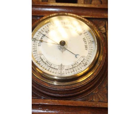 OAK BAROMETER AND A MAHOGANY MANTEL CLOCK