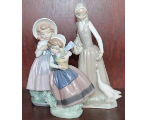 NAO FIGURE OF A WOMAN AND GOOSE
together with a Nao figure of a girl with flowers, and a Lladro figure of a girl with flowers