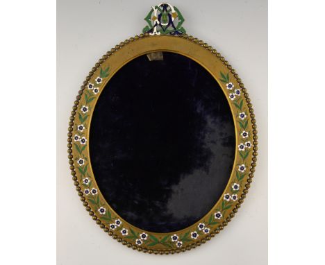  A gilt brass frame, incised and  decorated with enamelled flowers, the top with stylised monogram, silk velvet lining, 37 x 