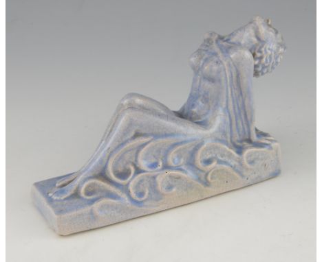 An Art Deco  ceramic crackle glaze figure of a reclining nude, based inscribed KAW  and dated 1937, 14.5 x 21 cm .      
