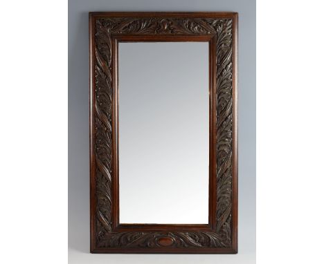 Arts & Crafts mahogany wall mirror, the frame heavily carved with Acanthus leaves, frame size 50 x 80 cm .      