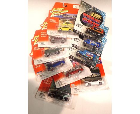 Johnny Lightning 1/64 scale diecast vehicles (x10): True Grit trucks (x3), Volkswagen Beetle and pick-up (x2) and Modern Musc