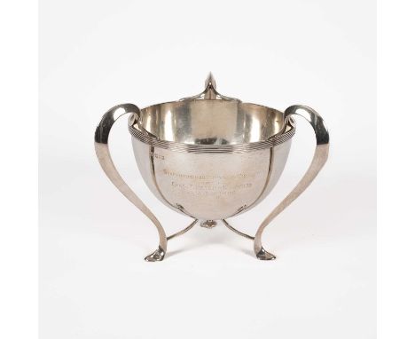 An Art Nouveau silver trophy cup, William Hutton &amp; Sons Ltd., London 1903, the circular bowl on three S-shaped legs, insc