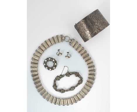 A quantity of silver jewellery, including a cuff bangle marked Sterling, a marcasite bracelet marked 935, a pair of earrings,