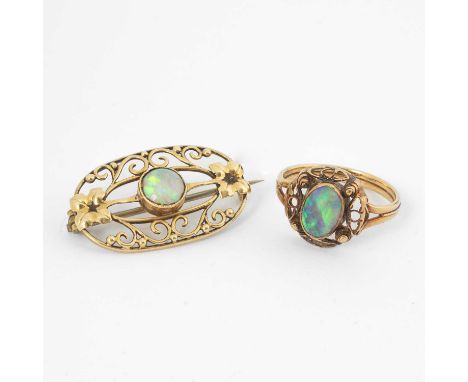 An Art Nouveau 15ct yellow gold and opal brooch, of oval openwork design, approximately 3cm long, maker's mark 'WHH', gross w