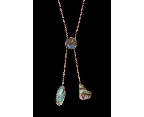 An Edwardian yellow gold and boulder opal lavaliere, set with three irregular boulder opals in claw settings, suspended from 