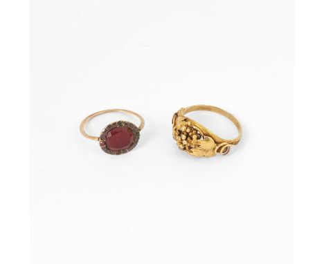An early 19th Century yellow metal and foil backed paste ring, size L½, total gross weight approximately 1.4g, together with 