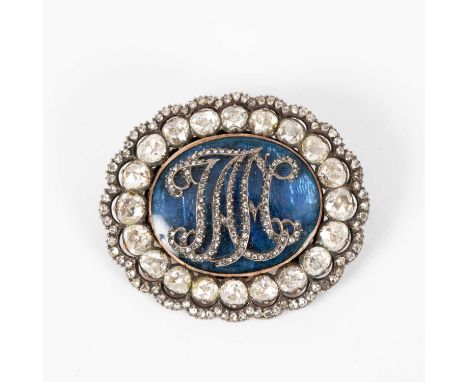 An oval paste and blue enamel brooch, early 20th Century, with initials, 4.5cm x 4cm
