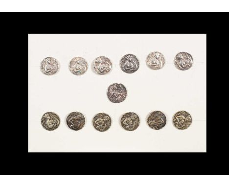 A group of thirteen buttons with female heads, to include a set of six silver buttons, another set of six base metal buttons,