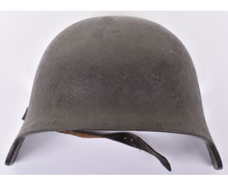 WW1 German Helmet Brow Plate, retaining much of the original paint finish. Leather strap attached. Stampings to the inside. 
