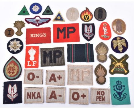 Grouping of British Cloth Insignia, including early paste back SAS beret badge, later pattern SAS beret badge / formation sig