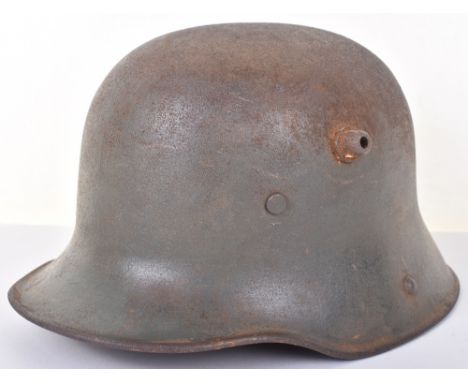 Imperial German M-16 Steel Combat Helmet, being a refurbished example with the exterior of the shell showing rusting and re-p