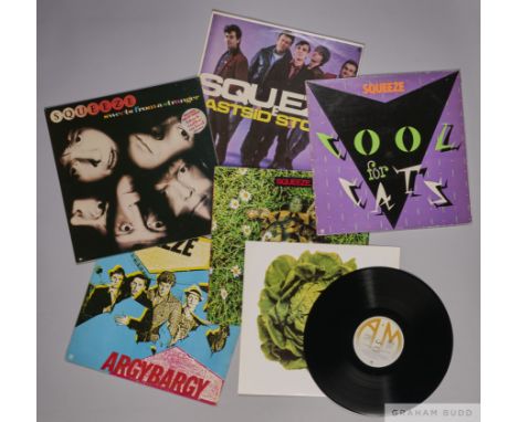 Five vinyl albums by the band Squeeze, including Cool for Cats, East Side Story, Argybargy, Sweets from a Stranger and Frank,