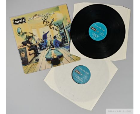 A first pressing of Oasis- Definitely Maybe, Creation Records 1994 signed by all five original members on the front cover in 