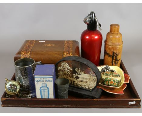 A tray of collectables to include Carltonware leaf dishes, carved cork picture, cocktail shakers, silver plate tankard with g