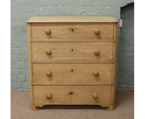 A pine chest of four drawers raised on bracket feet.