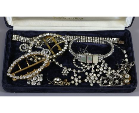 A collection of vintage white paste set jewellery including buckles, Art Deco drop earrings, articulated necklace and mother 