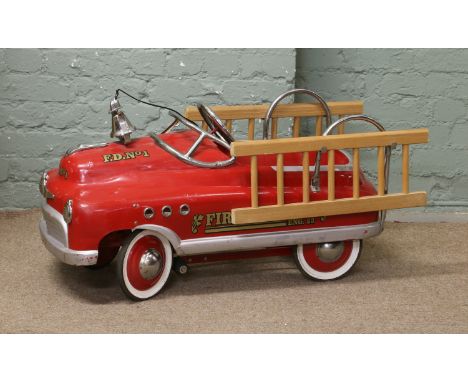 A childs vintage pedal car fire engine.