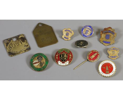 A collection of mining related enamel badges including N.U.M and two brass pit checks Brodsowrth and North Selby.