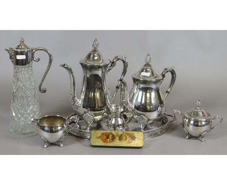 A silver plated teaset on gallery tray, a glass claret jug with plated mount and commemorative 1935 silver jubilee spoon set 