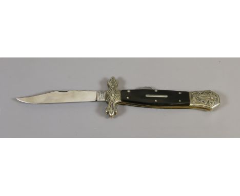 A locking folding dirk with shaped clip by Stan Shaw of Sheffield with buffalo horn scales, cast cross guard and pommel and h