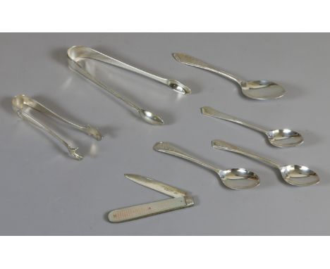 A collection of silver items including sugar tongues, teaspoons, along with a fruit knife with mother of pearl scales gross w