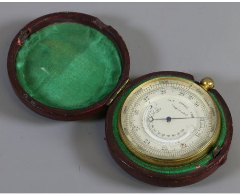A compensated pocket barometer in leather case.