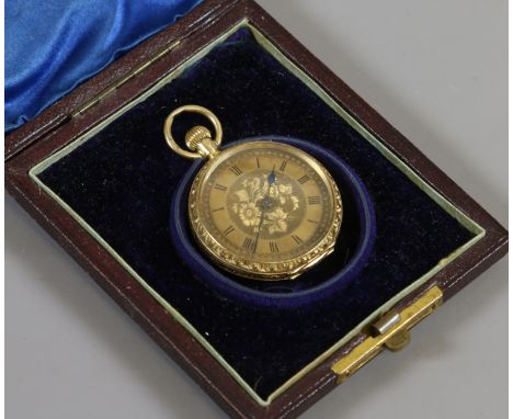 An Edwardian 18ct gold fob watch in associated case engraved with scrolling foliage and flower heads with gilt dial having bl