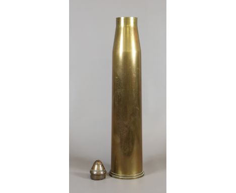 A World War II British army tank shell case together with a World War I H E fuse.
