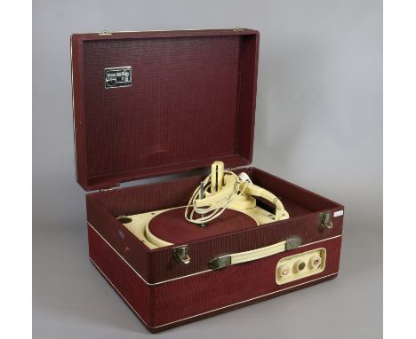 A vintage Collaro RC456 three valve portable record player in burgundy and cream case.