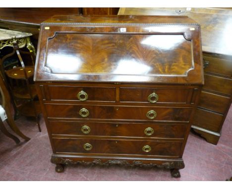 A good quality early 20th Century mahogany bureau, applied moulded edge top, inset shaped panel, fitted interior with central