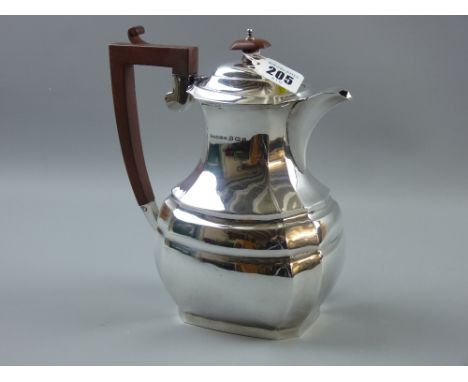 A silver coffeepot of oval form with step and lined decoration, 20 ozs gross, Birmingham 1931