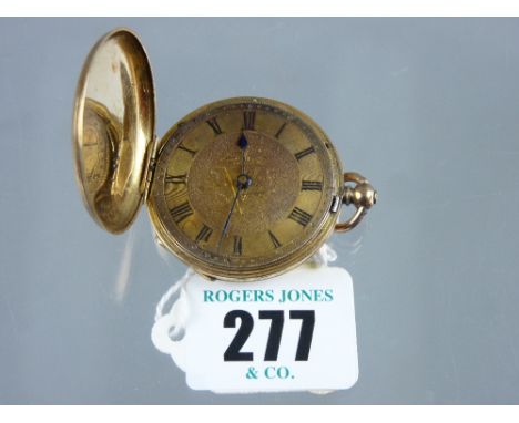 An eighteen carat gold encased lady's fob watch with finely patterned enamel front and back (no glass)