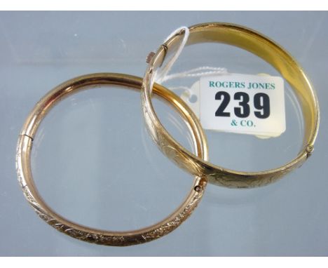 A nine carat gold half bright cut hollow bangle, 21 grms and a half bright cut, believed rolled gold bangle