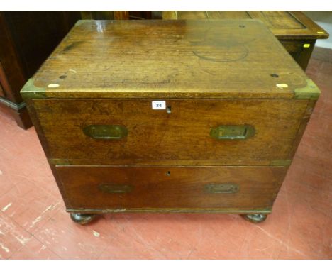 A compact mahogany two drawer campaign chest, brass bound with brass corners and with inset brass drop handles on corner bun 